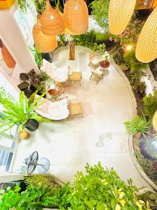 an overhead view of a garden with furniture and plants at Skyline Penthouse Greenery in Ho Chi Minh City