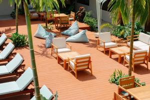 an overhead view of a patio with chairs and tables at Samawa Living in Paje