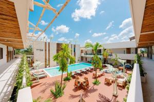 an image of the courtyard of a hotel with a swimming pool at Samawa Living in Paje