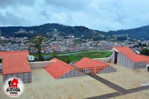 a view of a city from the roof of a building at Blossom Spring in Ooty