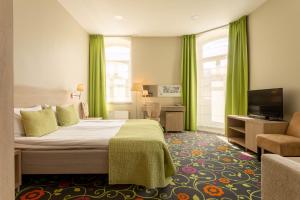 Postel nebo postele na pokoji v ubytování City Hotels Rūdninkai + 35 fotografií