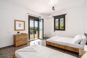 Ένα ή περισσότερα κρεβάτια σε δωμάτιο στο Patima Sea View