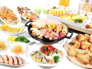 a table topped with lots of different types of food at Hotel Elcient Osaka Umeda in Osaka