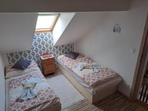 A bed or beds in a room at Privat Gazda Pension