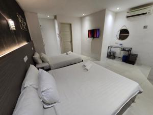 Letto o letti in una camera di One Point Hotel