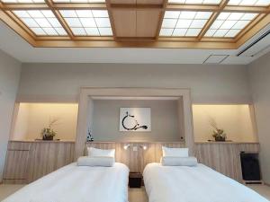 Ένα ή περισσότερα κρεβάτια σε δωμάτιο στο Ikoi no Mura Heritage Minoyama