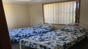 En eller flere senge i et værelse på Haven On Kingfisher