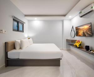 Postel nebo postele na pokoji v ubytování Boss Palace Hotel