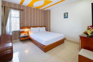 Postel nebo postele na pokoji v ubytování Boss Palace Hotel