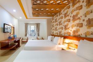 Postel nebo postele na pokoji v ubytování Boss Palace Hotel