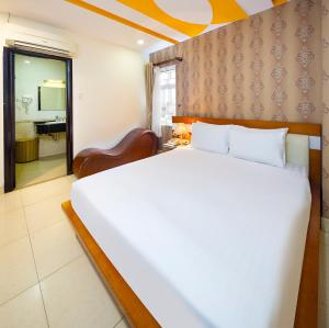 Postel nebo postele na pokoji v ubytování Boss Palace Hotel