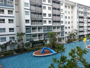an empty pool in front of a large apartment building at The Trust Hua Hin kitty room in Hua Hin