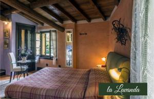 a bedroom with a bed and a table in a room at Il Borghetto Vacanze nei Mulini in Valeggio sul Mincio