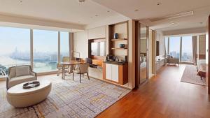 a living room with a couch and a table at InterContinental Guangzhou Exhibition Center, an IHG Hotel - Free Canton Fair Shuttle Bus and Registration Counter in Guangzhou