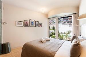 Postel nebo postele na pokoji v ubytování Aspasios City Oasis Apartments + 30 fotografií
