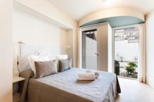 Postel nebo postele na pokoji v ubytování Aspasios City Oasis Apartments