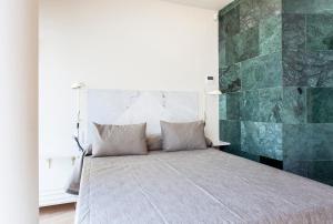 Postel nebo postele na pokoji v ubytování Aspasios City Oasis Apartments