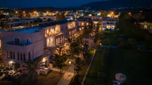 an aerial view of a building at night at Orpheas Resort Hotel (Adults Only) in Georgioupolis