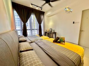 two beds in a room with a window at SeaView PoolView CityView BaliResidence Video game 5minJonker in Melaka