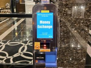 a bottle of money exchange on a counter at APA Hotel & Resort Nishishinjuku-Gochome-Eki Tower in Tokyo