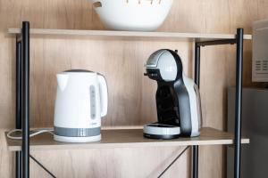 a coffee maker on a shelf in a kitchen at Mobile home Mia & Roko - Beach Porat, Drage in Drage