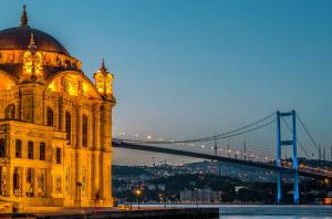 a large building with a bridge in the background at No25 Suites Nisantasi in Istanbul