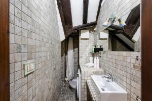 a bathroom with a sink and a toilet at Cozy Little House in Camogli by Wonderful Italy in Camogli