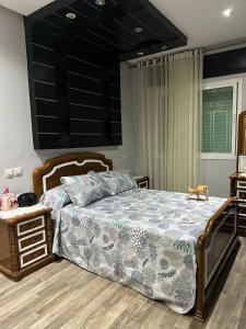 a bedroom with a large bed with a dog sitting on it at Appartement Tanger Lux in Tangier