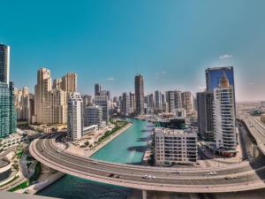 a view of a city with a river and buildings at Luxurious Apartments Dubai Marina Views Pool Gym by Sojo Stay in Dubai