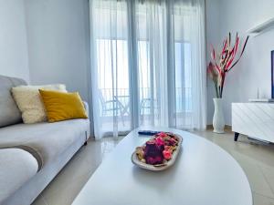 a living room with a table with a cake on it at No1 apartment 711 in Durrës