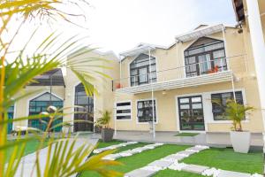 a house with a garden in front of it at Polokwane Estate Lodge & Spa in Polokwane