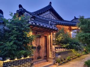 an asian style house with lights on it at Sarangroo in Jeonju