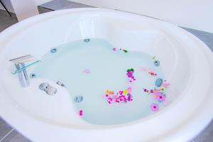 a bath tub filled with flowers in the shape of a toilet at FRESH HOTEL FALIRAKI in Faliraki