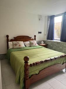 Postel nebo postele na pokoji v ubytování La Villa Carmela Cuma