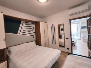 A bed or beds in a room at Residence Corallo
