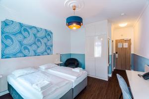 Postel nebo postele na pokoji v ubytování Hotel Prens Berlin