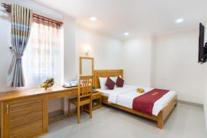 Postel nebo postele na pokoji v ubytování Thien Hai Hotel