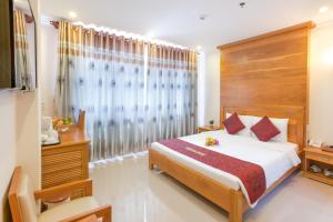 Postel nebo postele na pokoji v ubytování Thien Hai Hotel + 22 fotografií