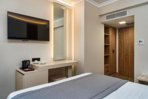 Postel nebo postele na pokoji v ubytování Palatino Hotel