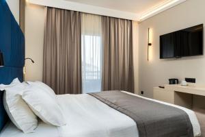 Postel nebo postele na pokoji v ubytování Palatino Hotel