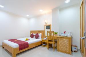Postel nebo postele na pokoji v ubytování Thien Hai Hotel
