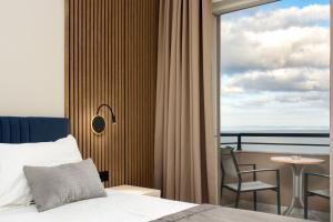 Postel nebo postele na pokoji v ubytování Palatino Hotel
