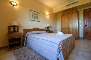Voodi või voodid majutusasutuse Cornucopia Hotel toas