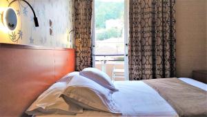 Postel nebo postele na pokoji v ubytování Palatino Hotel