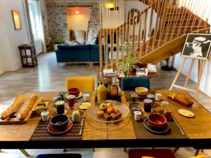 a table with a plate of food on it at Le Bercail in Plouézec