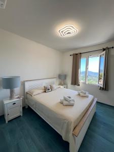 Postel nebo postele na pokoji v ubytování Casa vacanze Isola d' Elba Capoliveri La finestra nel blu