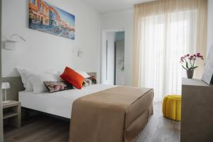 Postel nebo postele na pokoji v ubytování Nido Suite & Apartments