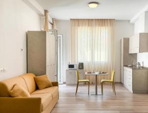 Kuchyň nebo kuchyňský kout v ubytování Nido Suite & Apartments