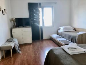 Postel nebo postele na pokoji v ubytování Apartments Curnić
