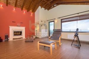 a living room with a camera and a fireplace at ''Villa Elia'' in Dhíkella +102 photos